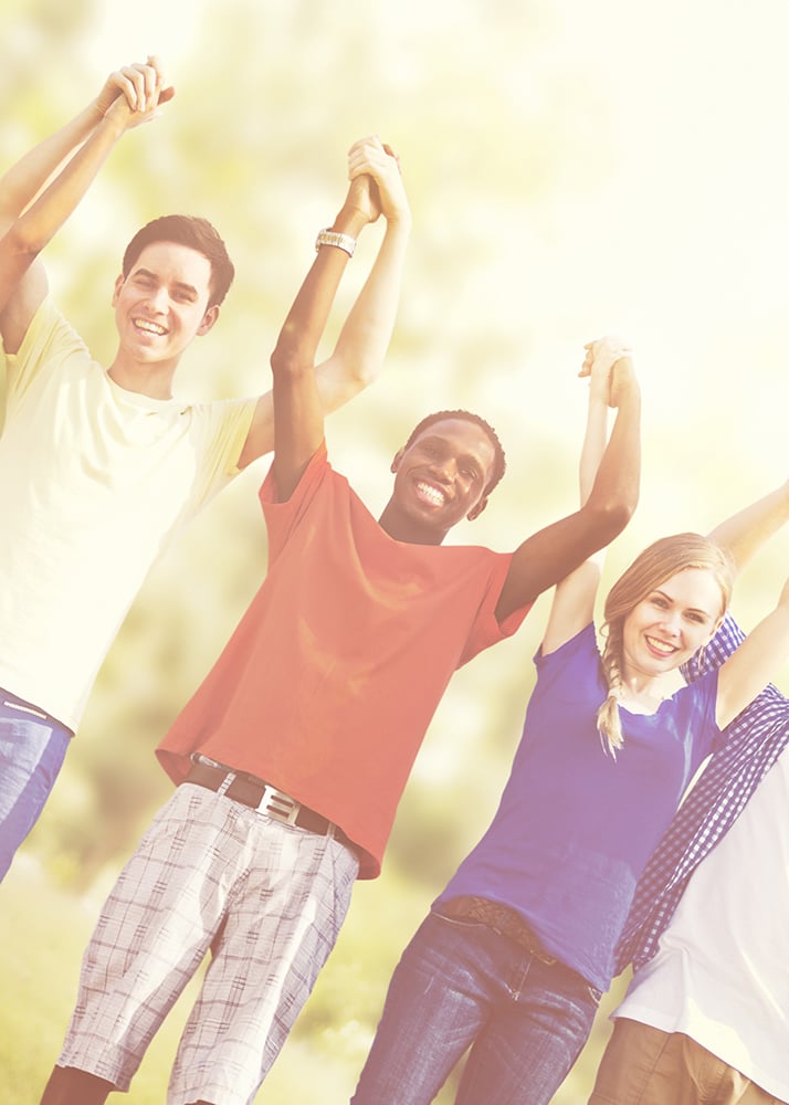 Young Christian Adults Raising Hands in Celebration